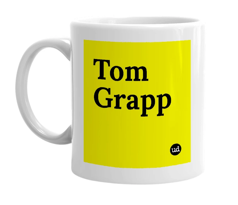 White mug with 'Tom Grapp' in bold black letters