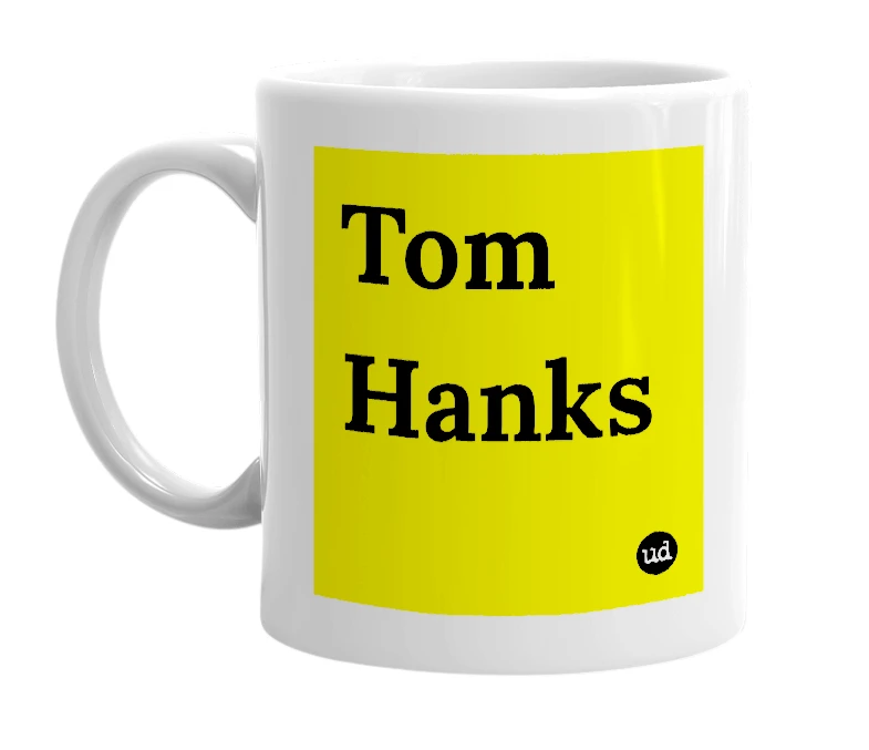 White mug with 'Tom Hanks' in bold black letters
