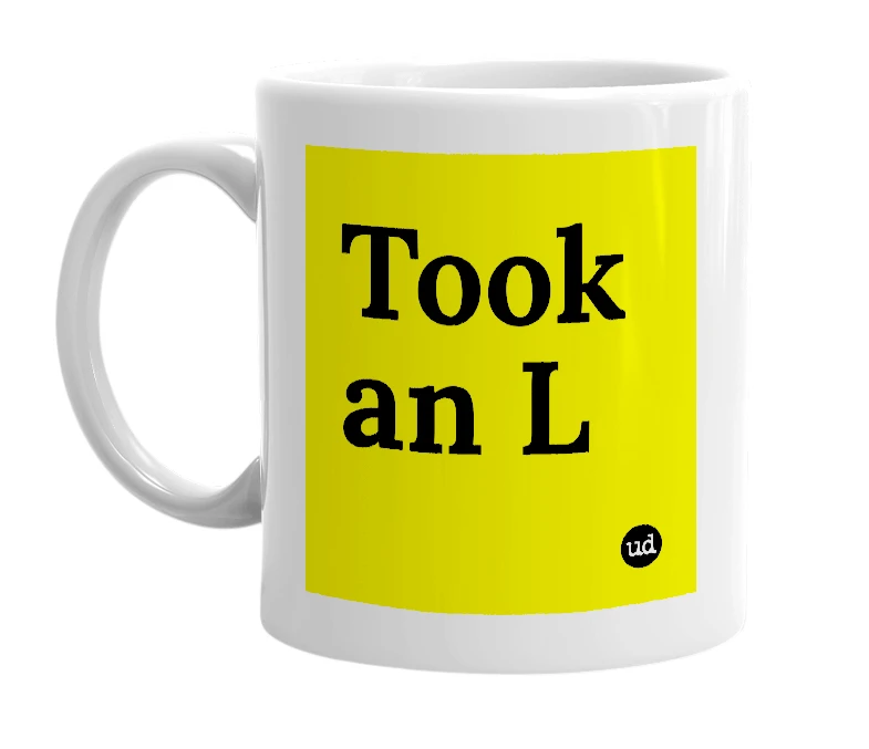 White mug with 'Took an L' in bold black letters