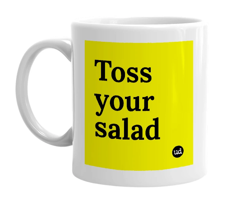 White mug with 'Toss your salad' in bold black letters