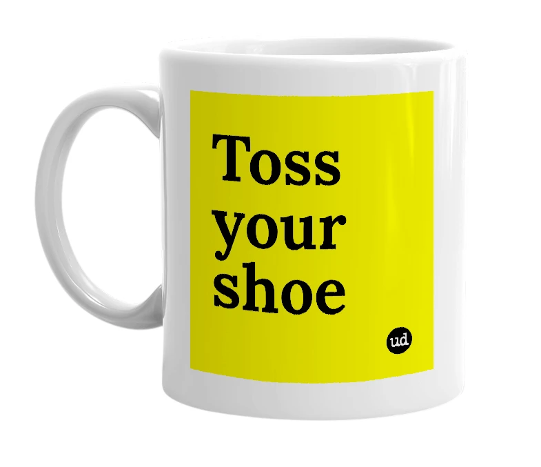 White mug with 'Toss your shoe' in bold black letters