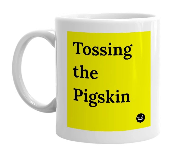 White mug with 'Tossing the Pigskin' in bold black letters