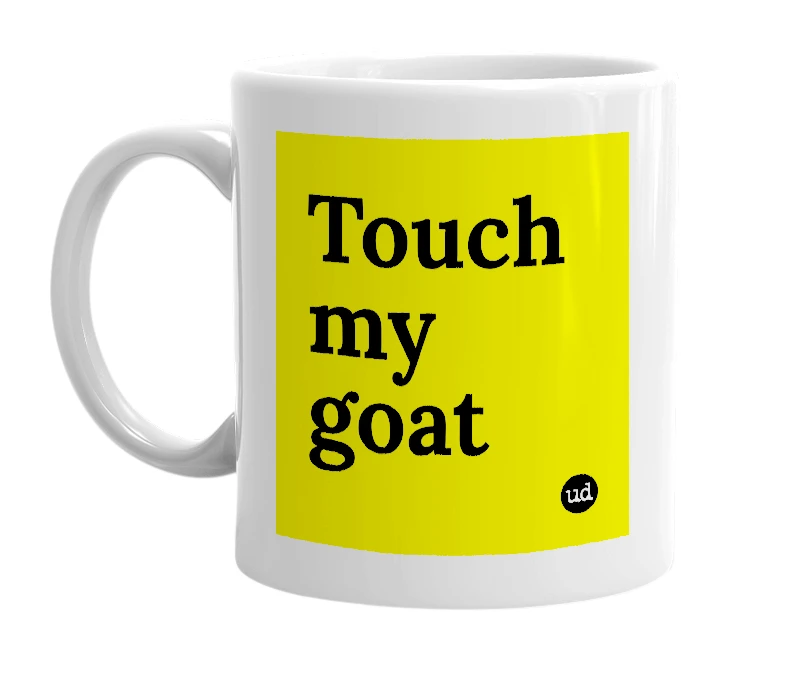 White mug with 'Touch my goat' in bold black letters