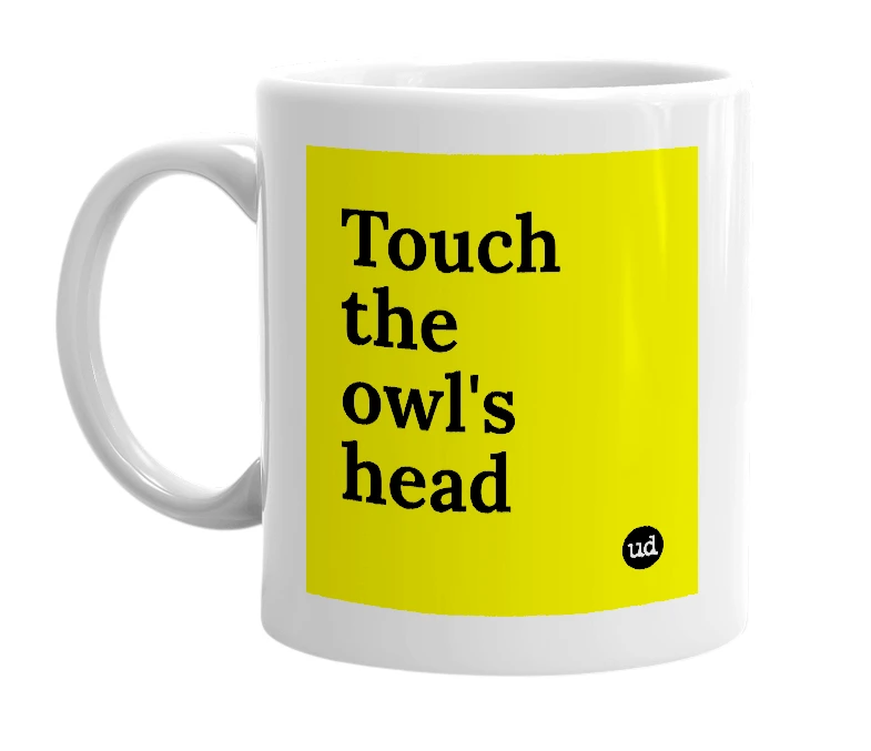 White mug with 'Touch the owl's head' in bold black letters