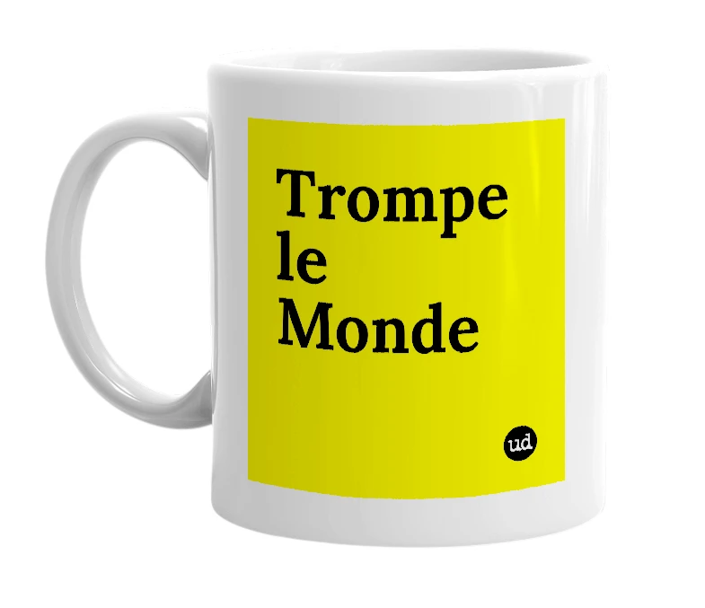 White mug with 'Trompe le Monde' in bold black letters