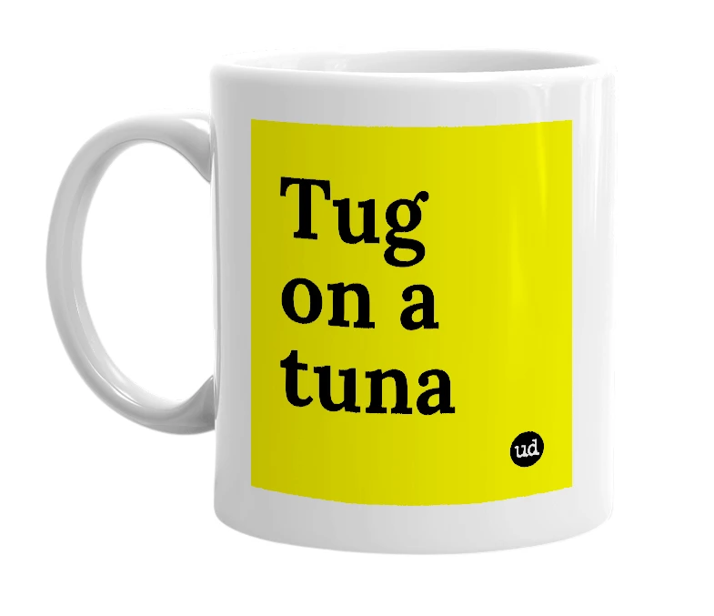 White mug with 'Tug on a tuna' in bold black letters