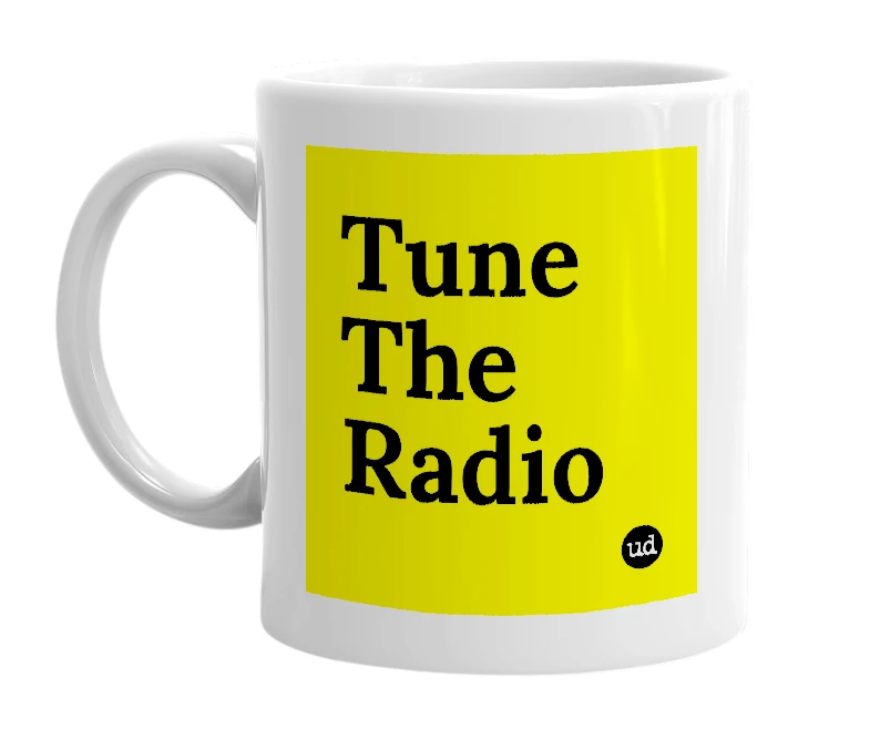 White mug with 'Tune The Radio' in bold black letters