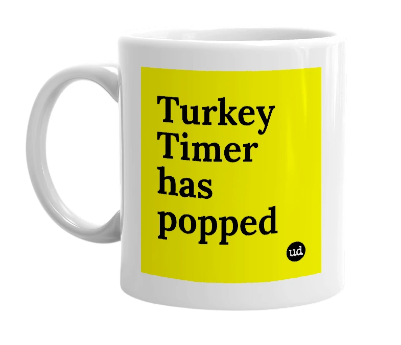 White mug with 'Turkey Timer has popped' in bold black letters