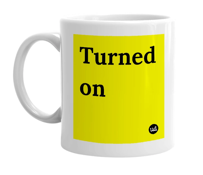 White mug with 'Turned on' in bold black letters