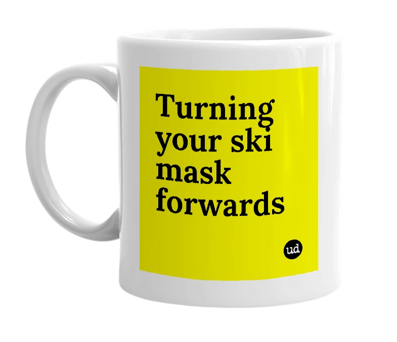 White mug with 'Turning your ski mask forwards' in bold black letters