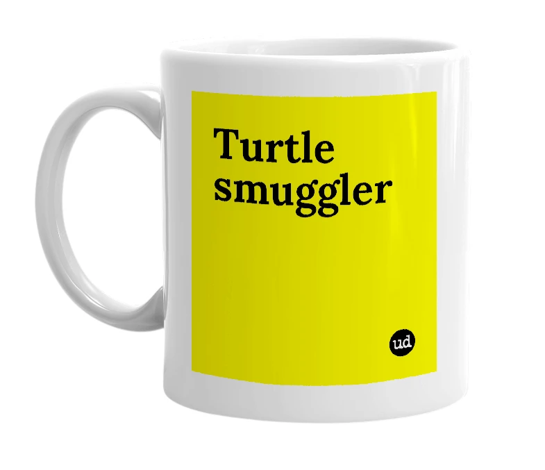 White mug with 'Turtle smuggler' in bold black letters