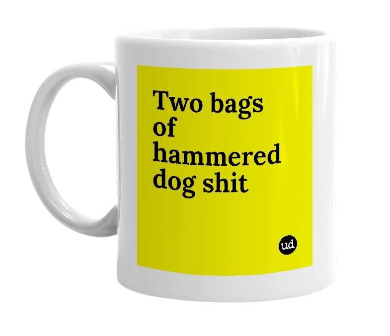 White mug with 'Two bags of hammered dog shit' in bold black letters