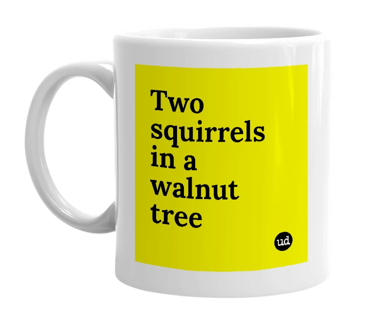 White mug with 'Two squirrels in a walnut tree' in bold black letters