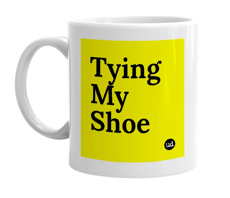 White mug with 'Tying My Shoe' in bold black letters