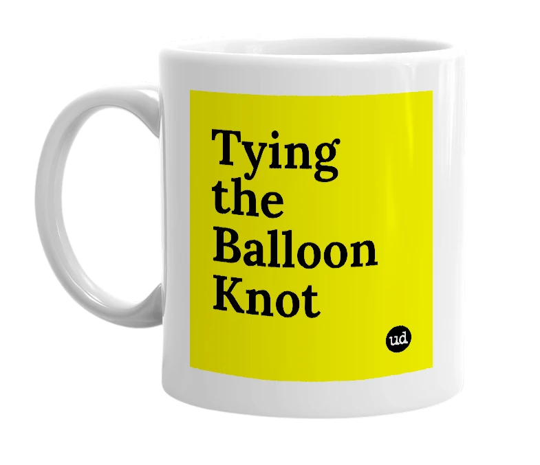 White mug with 'Tying the Balloon Knot' in bold black letters