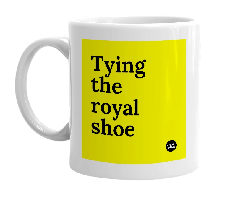 White mug with 'Tying the royal shoe' in bold black letters