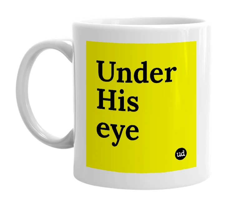 White mug with 'Under His eye' in bold black letters