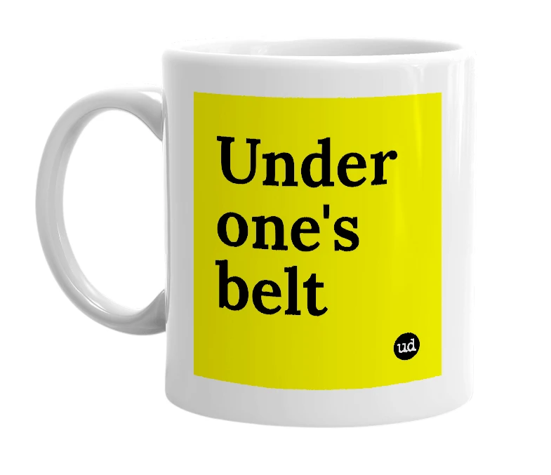 White mug with 'Under one's belt' in bold black letters