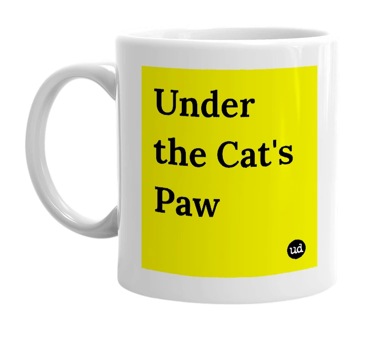 White mug with 'Under the Cat's Paw' in bold black letters