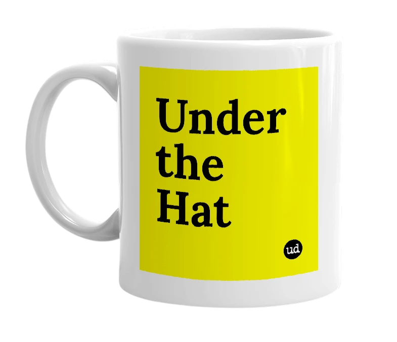 White mug with 'Under the Hat' in bold black letters