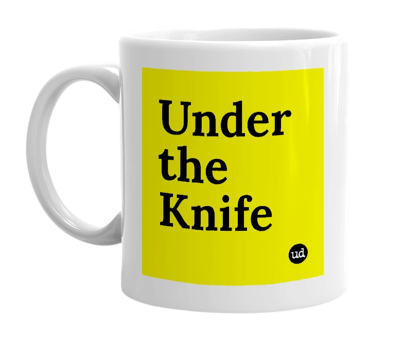 White mug with 'Under the Knife' in bold black letters