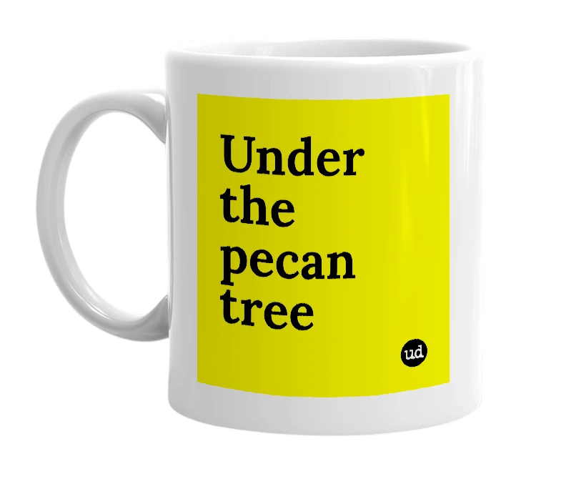 White mug with 'Under the pecan tree' in bold black letters