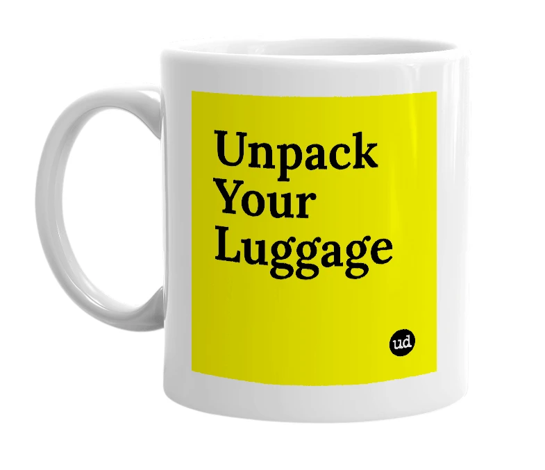 White mug with 'Unpack Your Luggage' in bold black letters