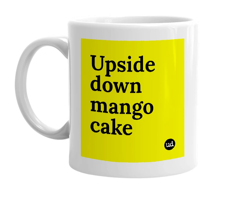 White mug with 'Upside down mango cake' in bold black letters