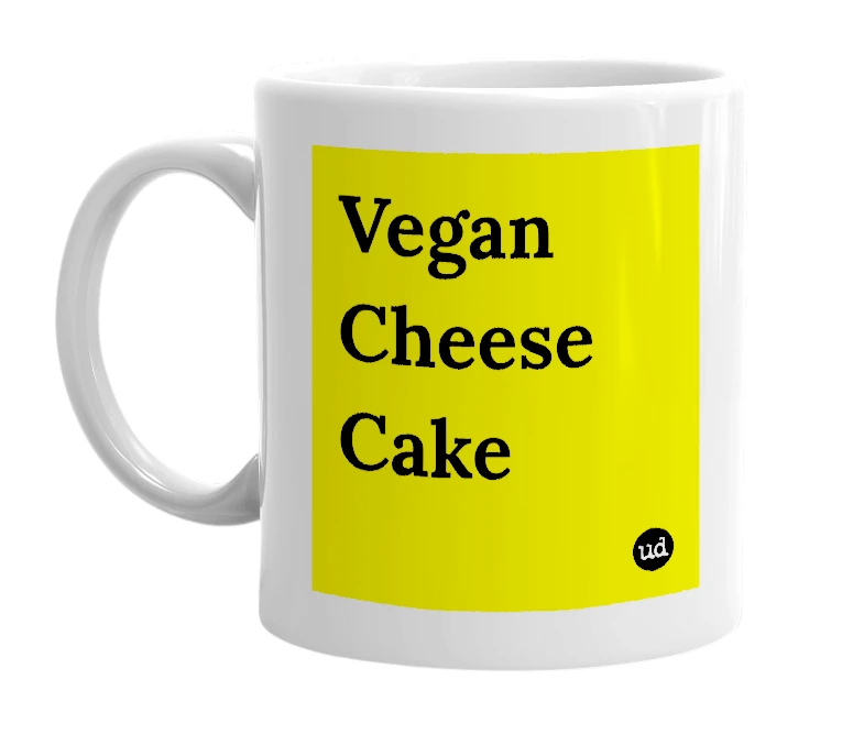 White mug with 'Vegan Cheese Cake' in bold black letters