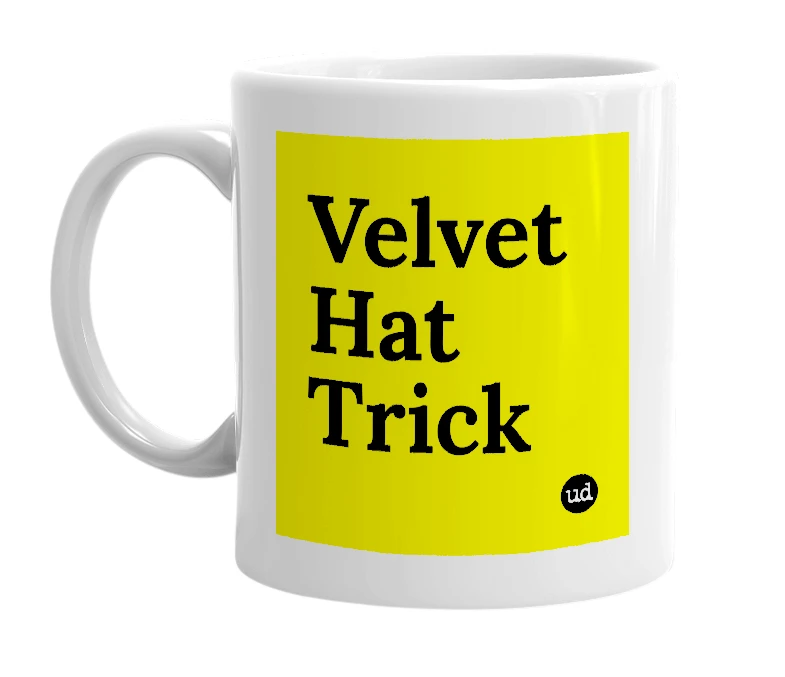 White mug with 'Velvet Hat Trick' in bold black letters