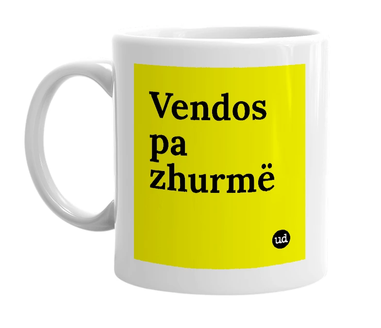 White mug with 'Vendos pa zhurmë' in bold black letters