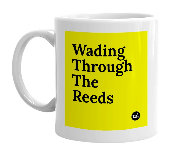 White mug with 'Wading Through The Reeds' in bold black letters