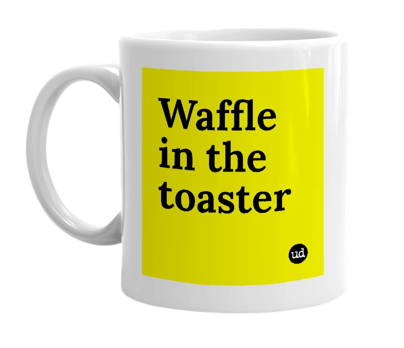 White mug with 'Waffle in the toaster' in bold black letters