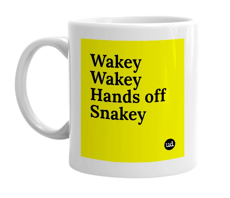 White mug with 'Wakey Wakey Hands off Snakey' in bold black letters