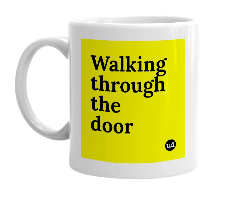 White mug with 'Walking through the door' in bold black letters