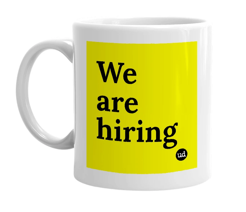 White mug with 'We are hiring' in bold black letters