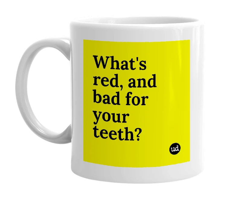 White mug with 'What's red, and bad for your teeth?' in bold black letters