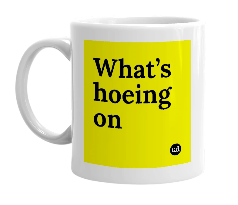 White mug with 'What’s hoeing on' in bold black letters
