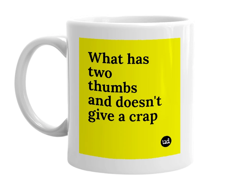 White mug with 'What has two thumbs and doesn't give a crap' in bold black letters