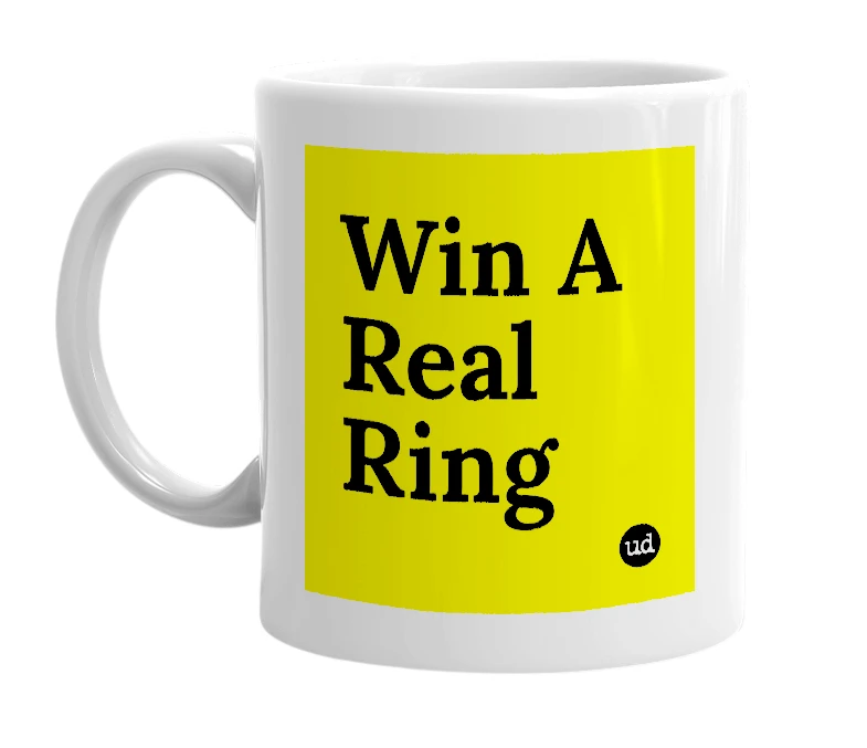 White mug with 'Win A Real Ring' in bold black letters