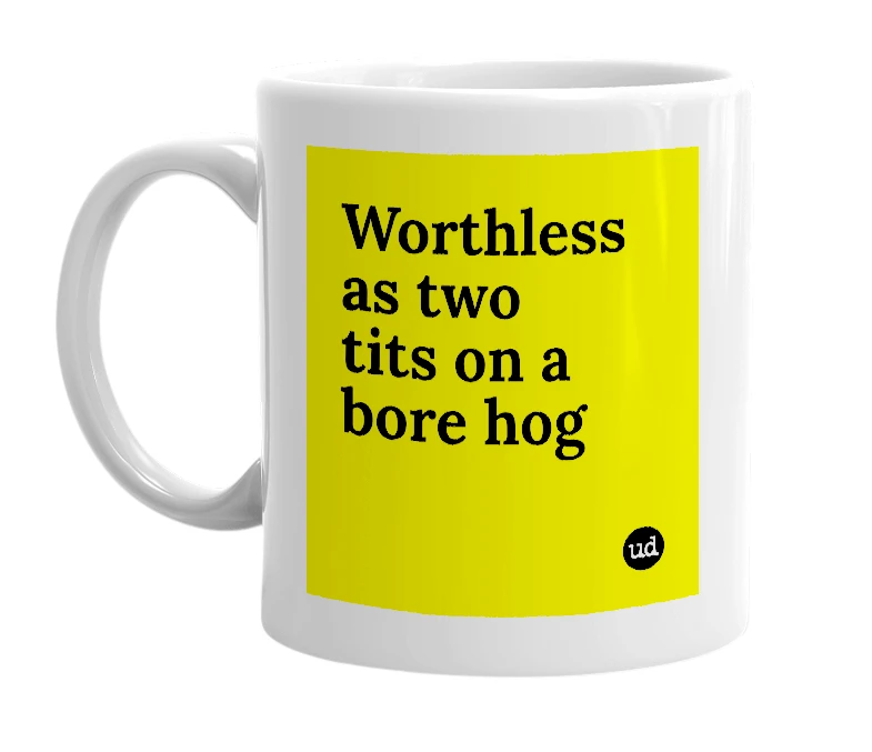 White mug with 'Worthless as two tits on a bore hog' in bold black letters