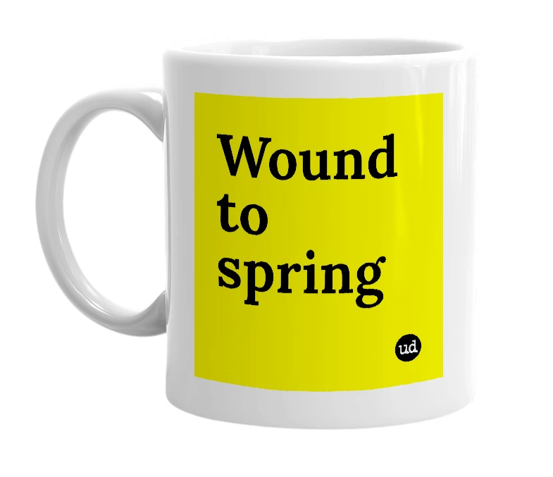 White mug with 'Wound to spring' in bold black letters