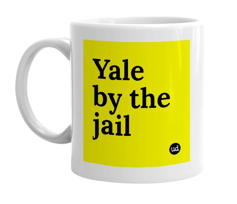 White mug with 'Yale by the jail' in bold black letters