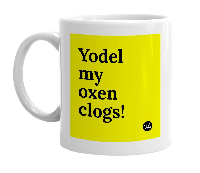 White mug with 'Yodel my oxen clogs!' in bold black letters