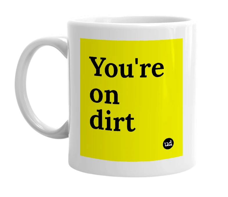 White mug with 'You're on dirt' in bold black letters