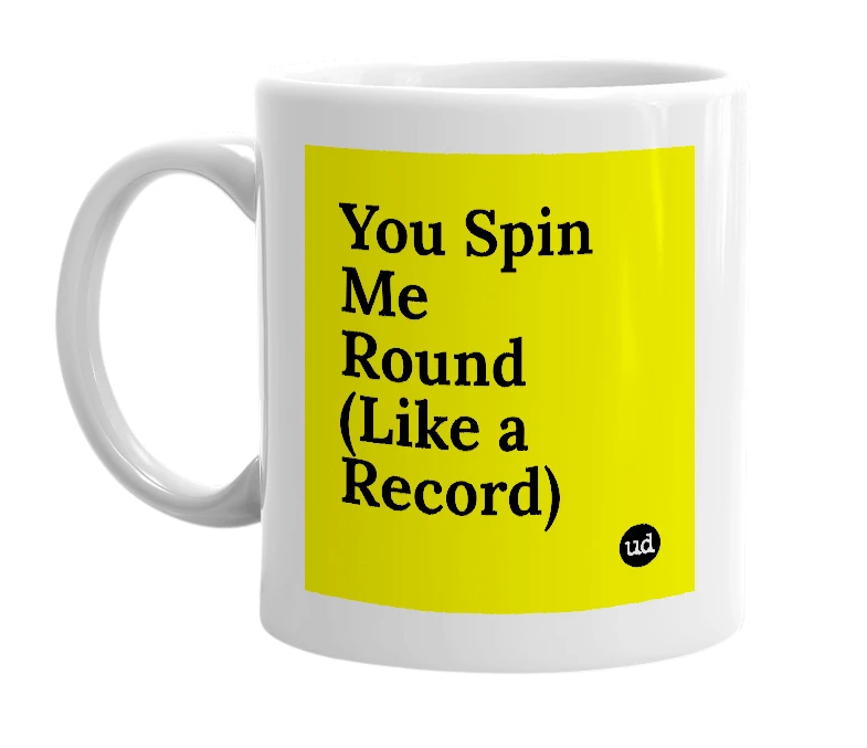 White mug with 'You Spin Me Round (Like a Record)' in bold black letters