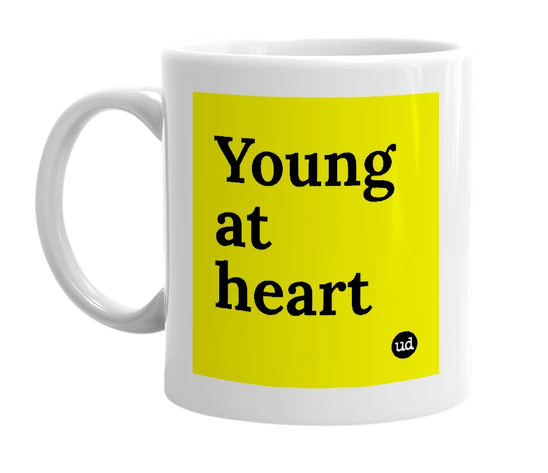 White mug with 'Young at heart' in bold black letters