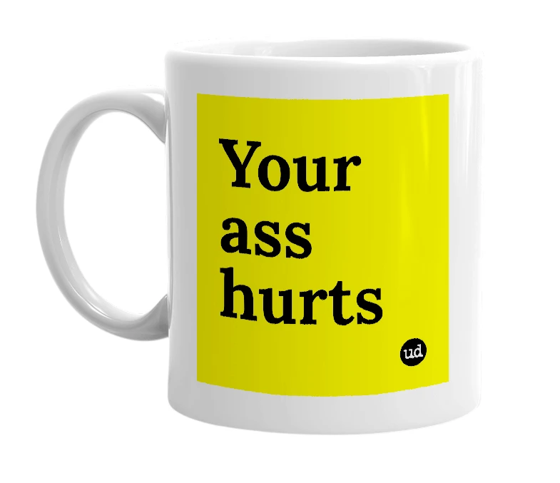 White mug with 'Your ass hurts' in bold black letters