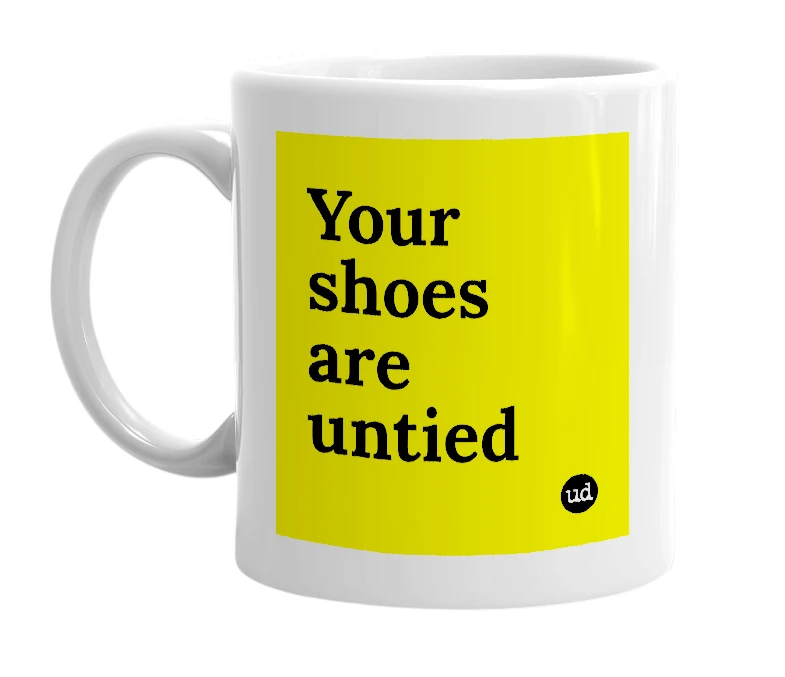 White mug with 'Your shoes are untied' in bold black letters