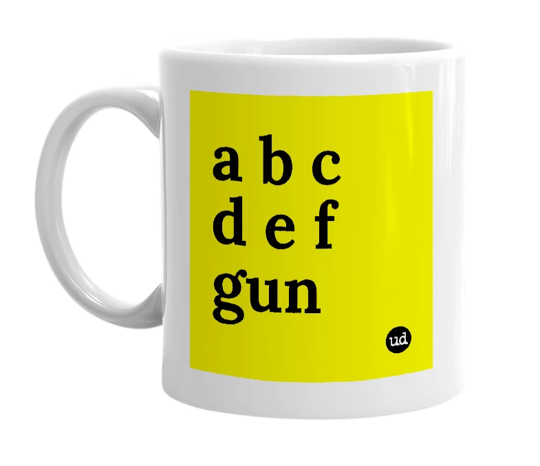 White mug with 'a b c d e f gun' in bold black letters